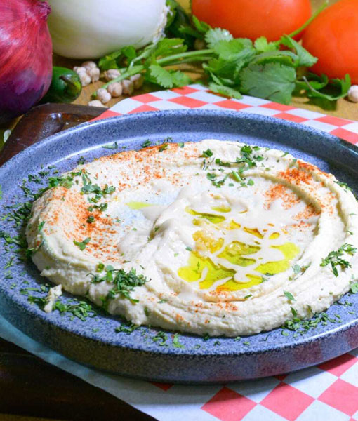 Plate of Hummus Olive Oil Cilantro and Pita